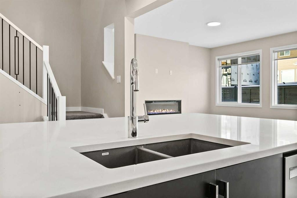 164 Wolf River Drive Se, Calgary, AB - Indoor Photo Showing Kitchen With Double Sink
