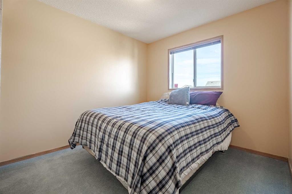 82 Martinridge Crescent Ne, Calgary, AB - Indoor Photo Showing Bedroom