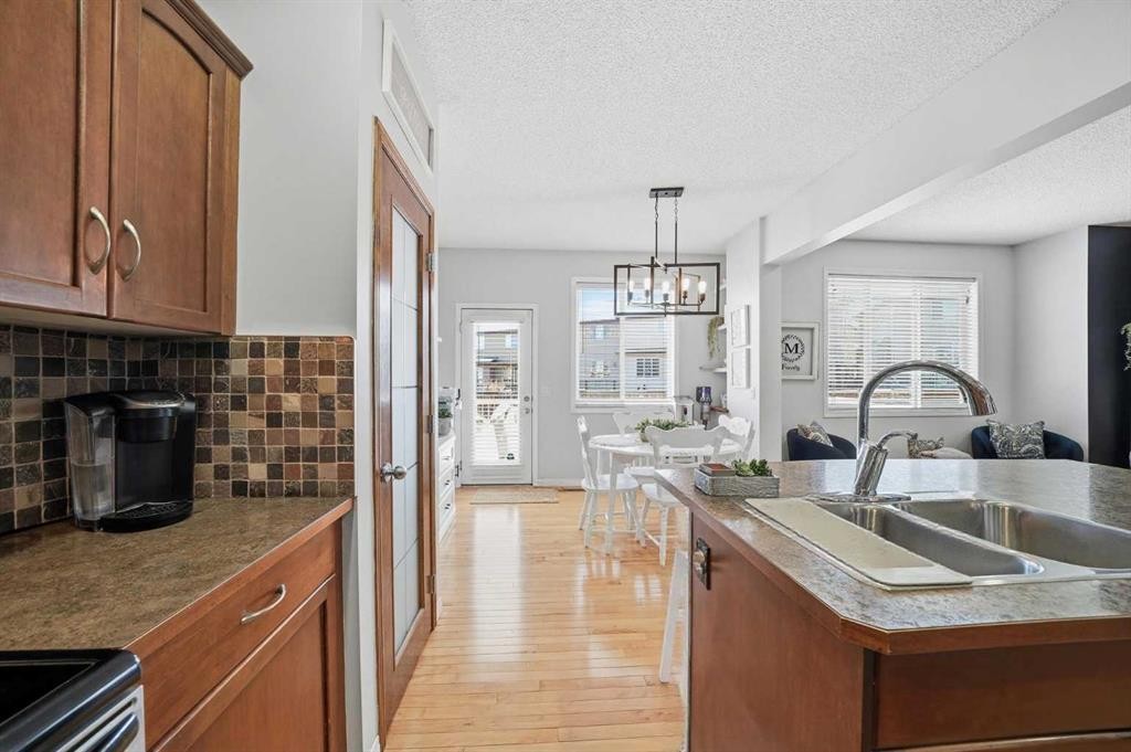 155 Cimarron Grove Circle, Okotoks, AB - Indoor Photo Showing Kitchen With Double Sink