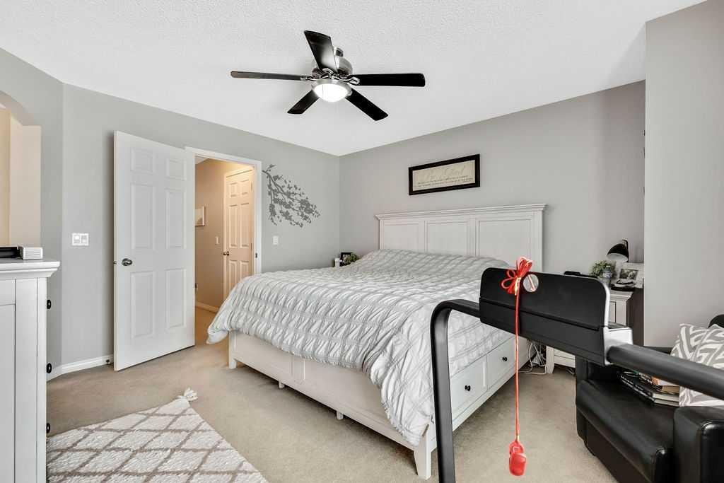 155 Cimarron Grove Circle, Okotoks, AB - Indoor Photo Showing Bedroom