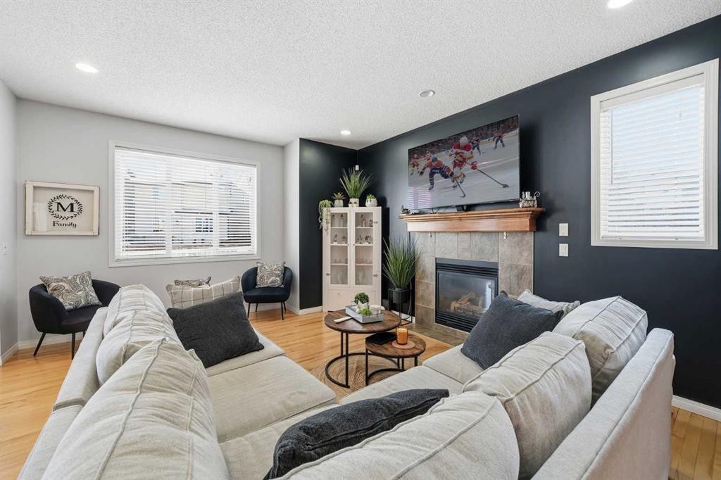 155 Cimarron Grove Circle, Okotoks, AB - Indoor Photo Showing Living Room With Fireplace