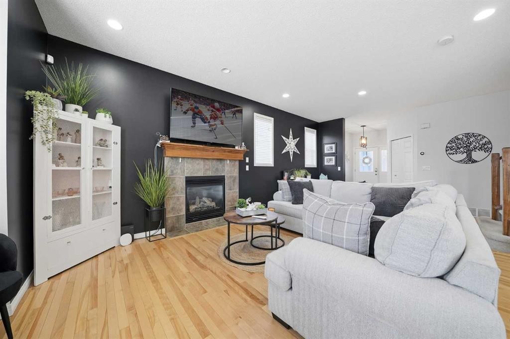 155 Cimarron Grove Circle, Okotoks, AB - Indoor Photo Showing Living Room With Fireplace