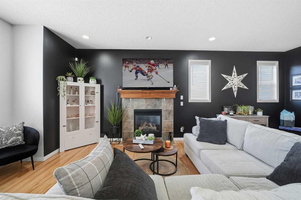 155 Cimarron Grove Circle, Okotoks, AB - Indoor Photo Showing Living Room With Fireplace