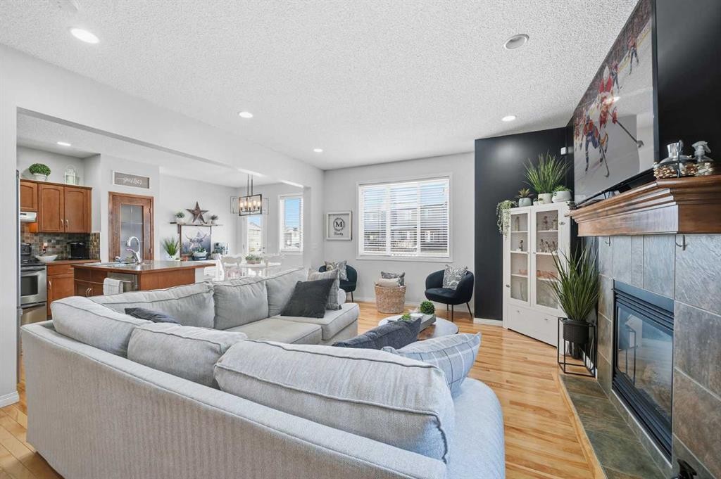 155 Cimarron Grove Circle, Okotoks, AB - Indoor Photo Showing Living Room With Fireplace