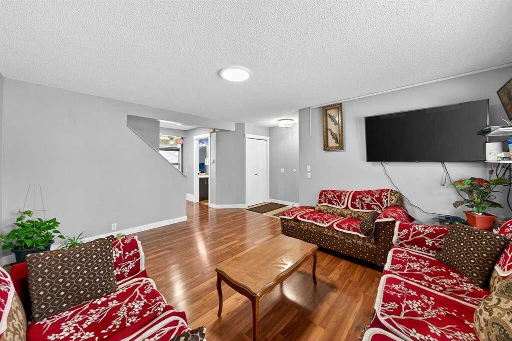 214 Martinwood Place Ne, Calgary, AB - Indoor Photo Showing Living Room