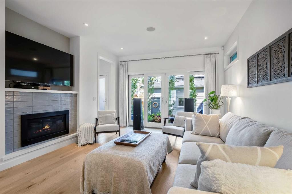 2136 53 Avenue Sw, Calgary, AB - Indoor Photo Showing Living Room With Fireplace