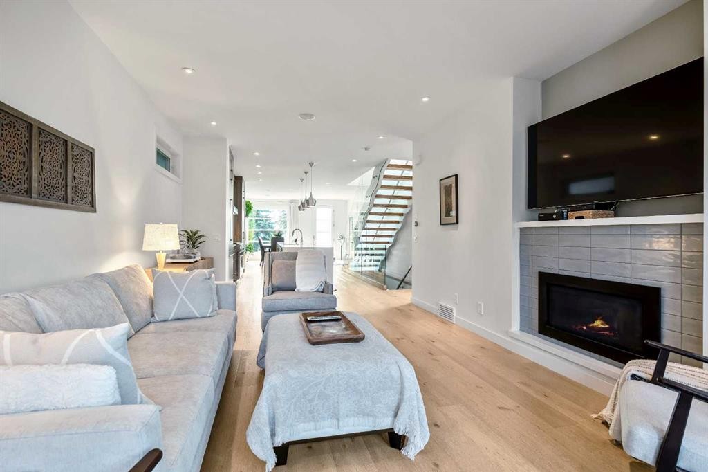 2136 53 Avenue Sw, Calgary, AB - Indoor Photo Showing Living Room With Fireplace