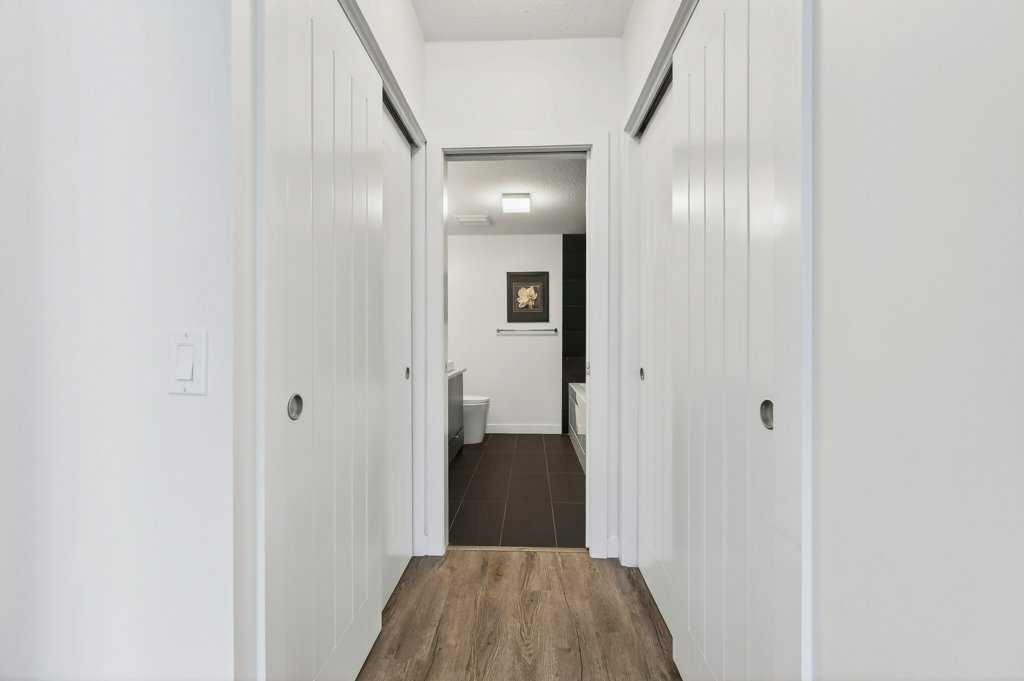 201-25 Aspenmont Heights Sw, Calgary, AB - Indoor Photo Showing Other Room