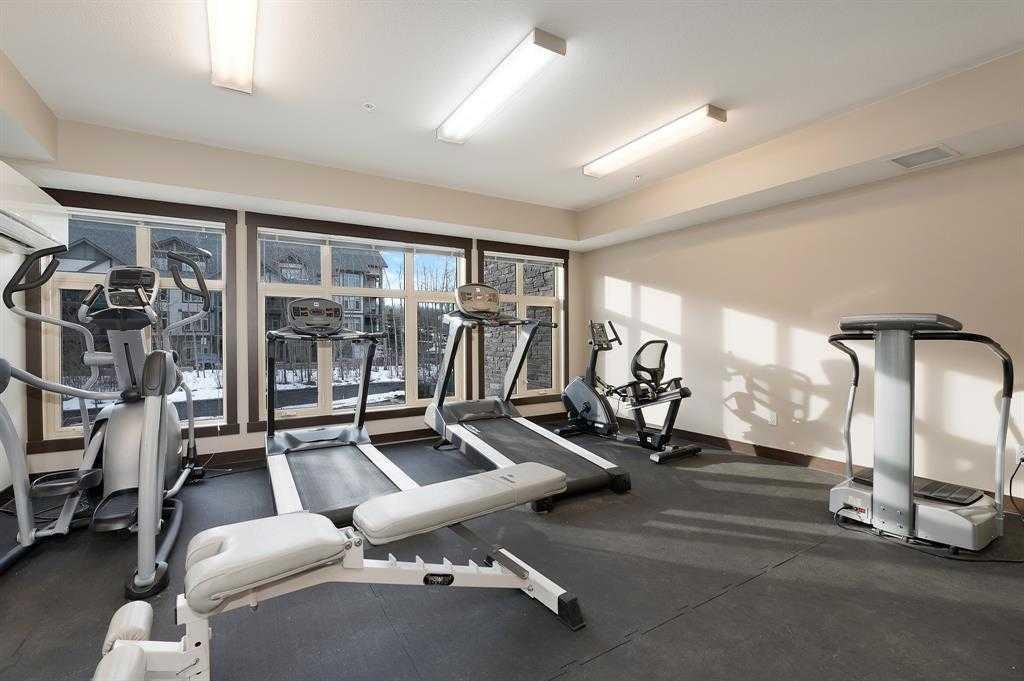 201-25 Aspenmont Heights Sw, Calgary, AB - Indoor Photo Showing Gym Room