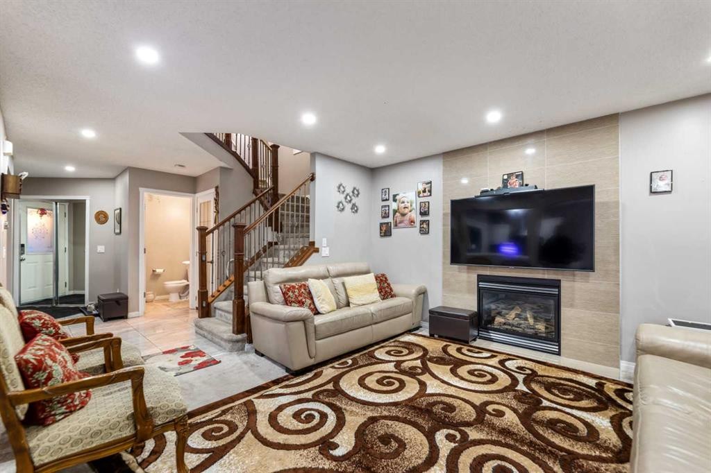 57 Saddlemead Road Ne, Calgary, AB - Indoor Photo Showing Other Room With Fireplace