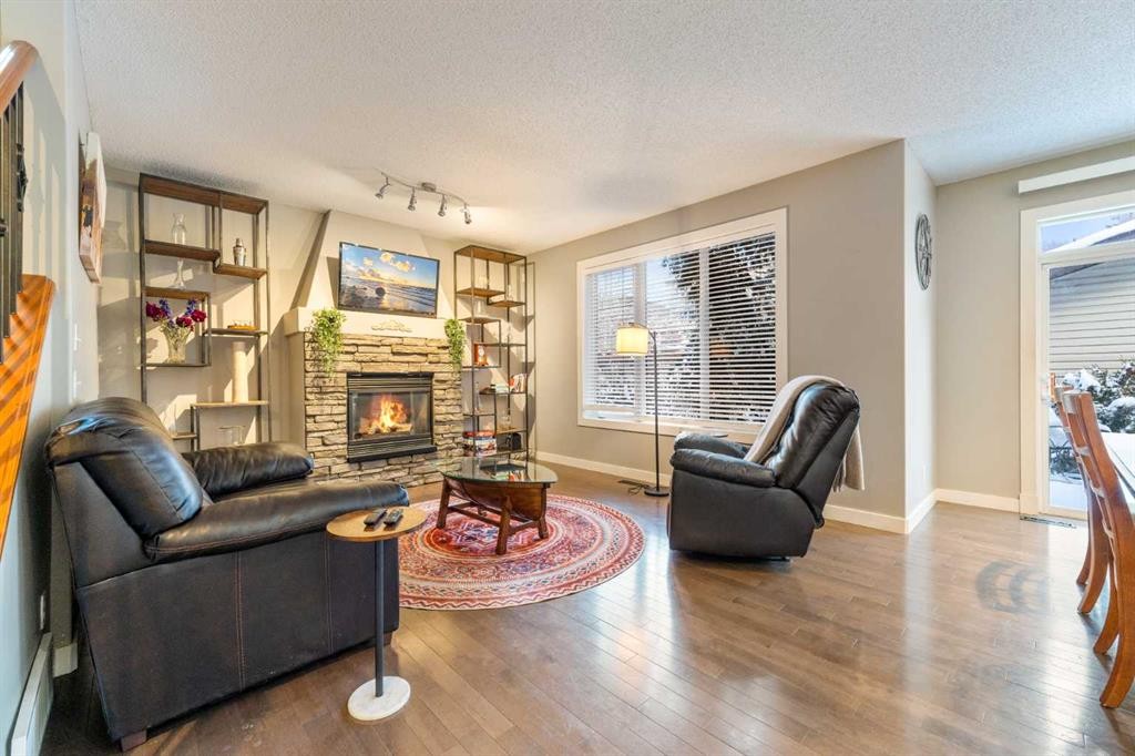 4 Crestridge Way Sw, Calgary, AB - Indoor Photo Showing Living Room With Fireplace