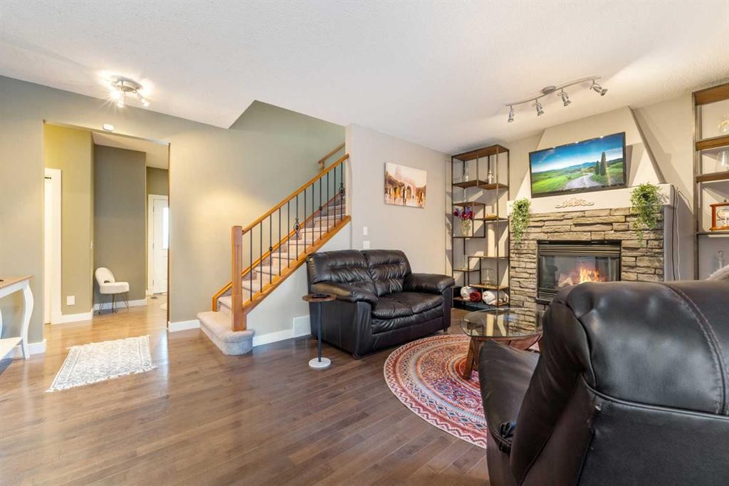 4 Crestridge Way Sw, Calgary, AB - Indoor Photo Showing Living Room With Fireplace