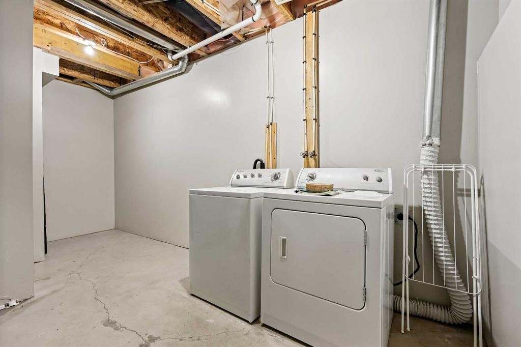 64 Elgin Gardens Se, Calgary, AB - Indoor Photo Showing Laundry Room