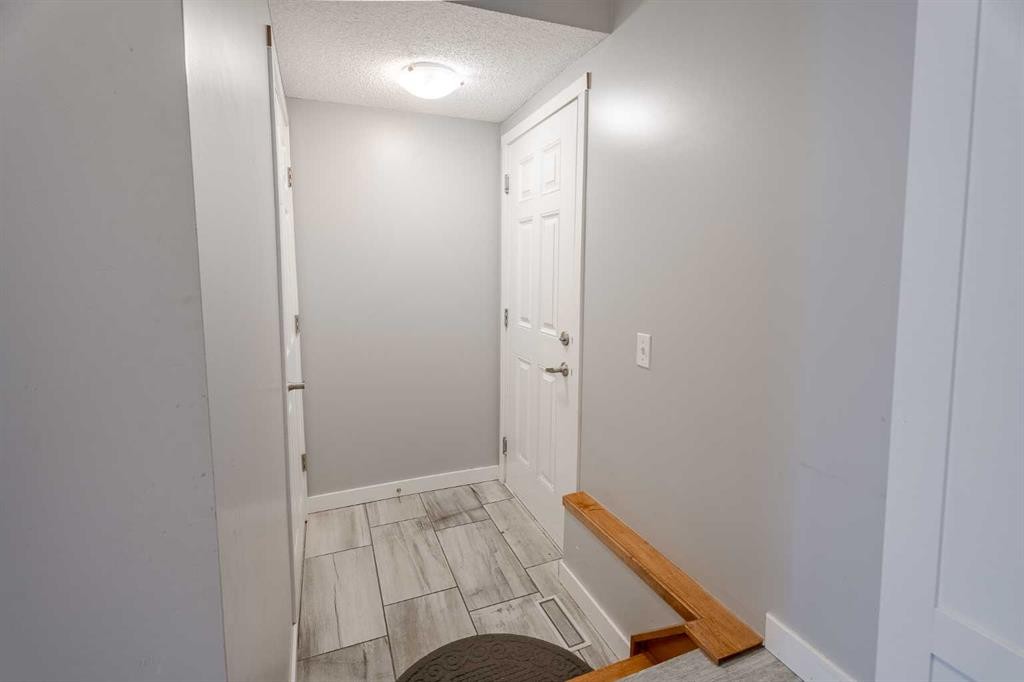 3098 Windsong Boulevard Sw, Airdrie, AB - Indoor Photo Showing Other Room