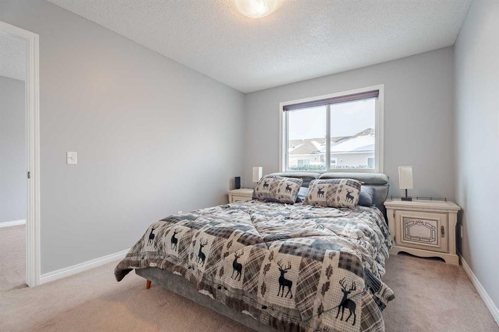 3098 Windsong Boulevard Sw, Airdrie, AB - Indoor Photo Showing Bedroom