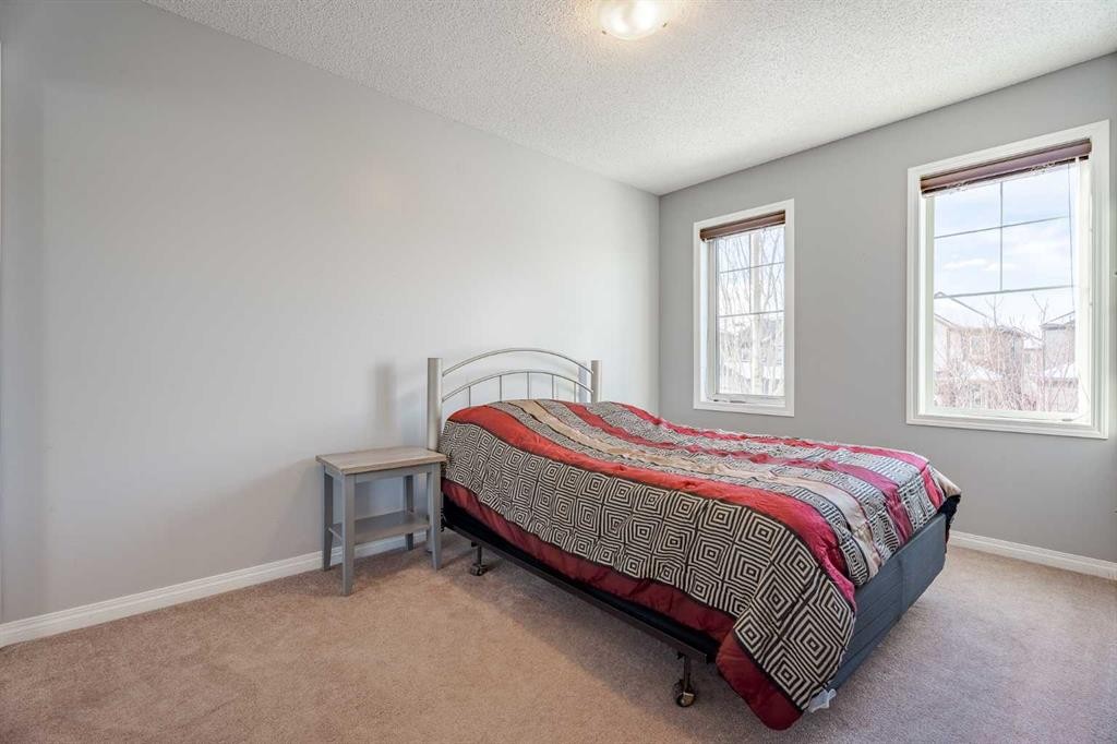 3098 Windsong Boulevard Sw, Airdrie, AB - Indoor Photo Showing Bedroom