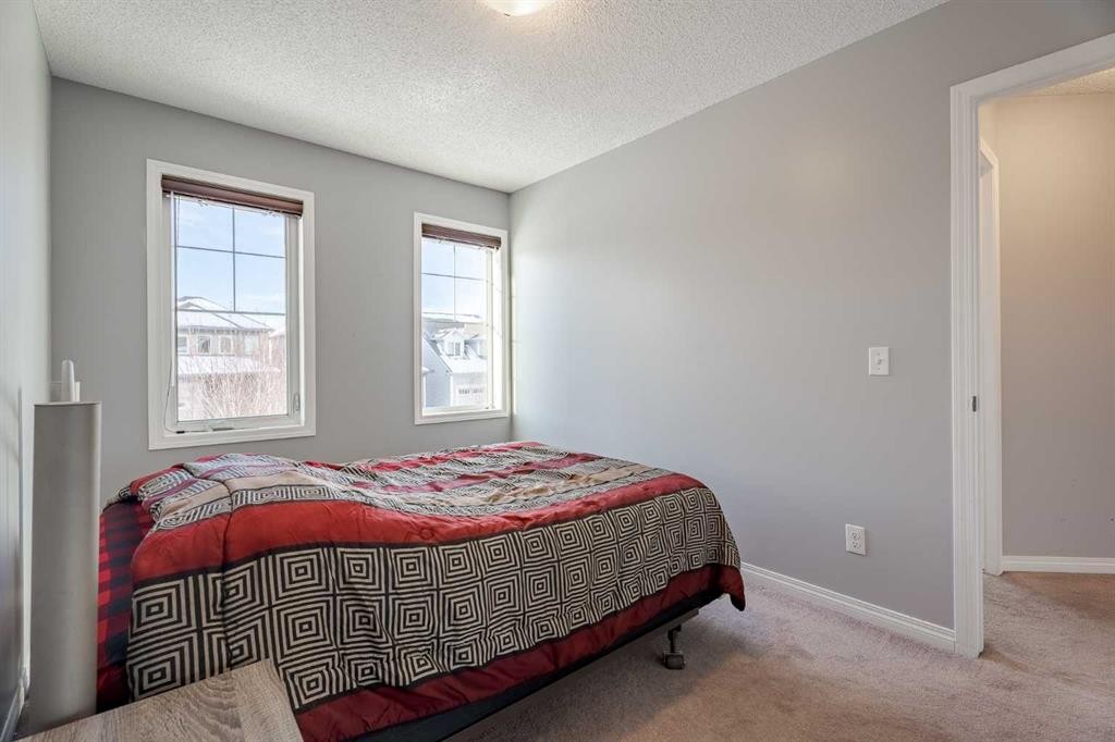 3098 Windsong Boulevard Sw, Airdrie, AB - Indoor Photo Showing Bedroom