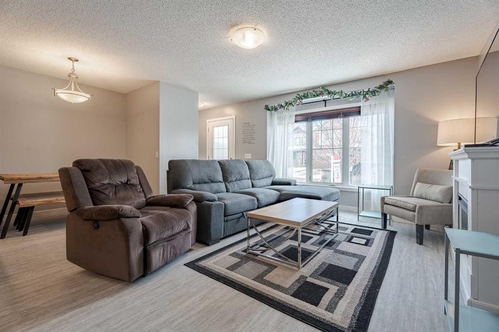 3098 Windsong Boulevard Sw, Airdrie, AB - Indoor Photo Showing Living Room