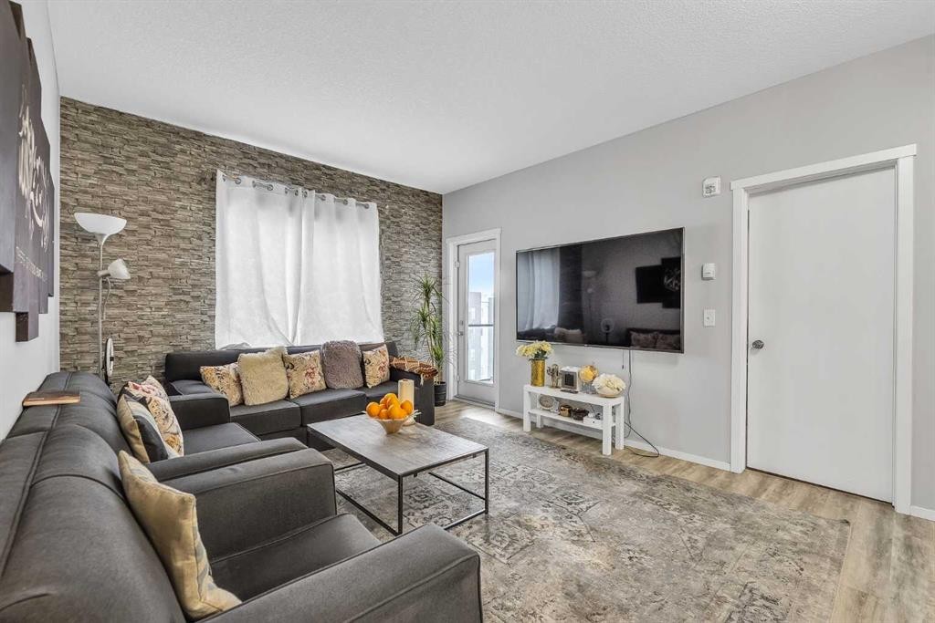 1613-4641 128 Avenue Ne, Calgary, AB - Indoor Photo Showing Living Room