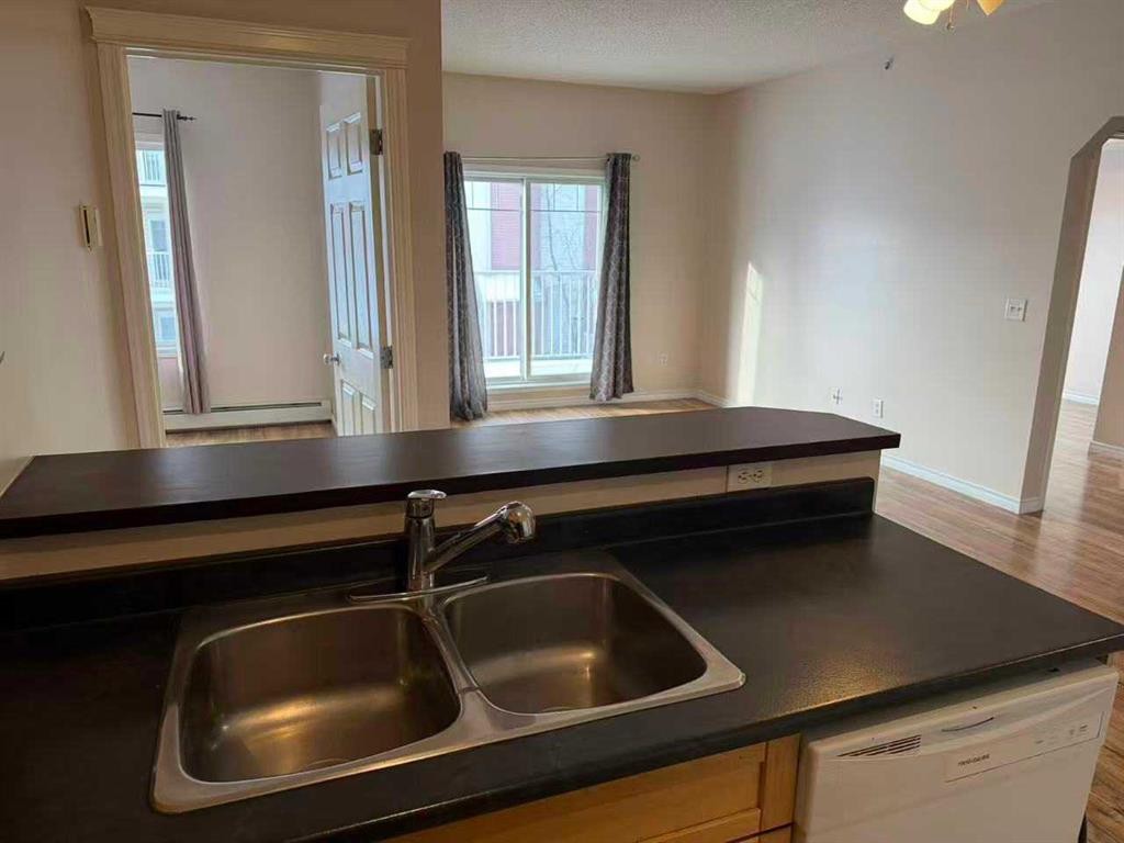 3315-70 Panamount Drive Nw, Calgary, AB - Indoor Photo Showing Kitchen With Double Sink