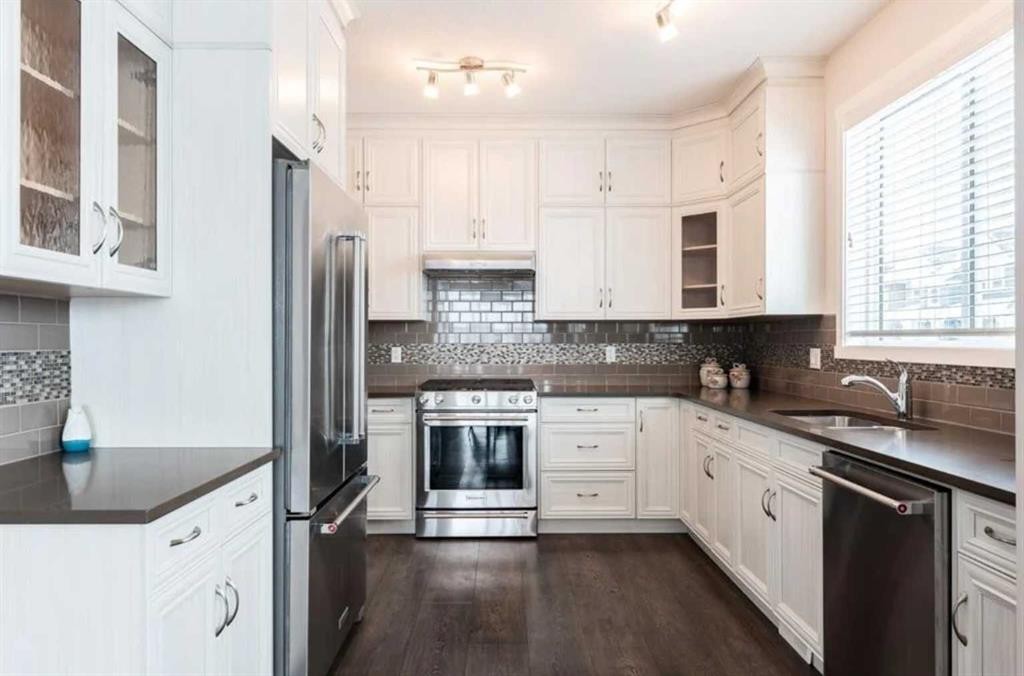 12 Legacy Main Street Se, Calgary, AB - Indoor Photo Showing Kitchen With Stainless Steel Kitchen With Double Sink
