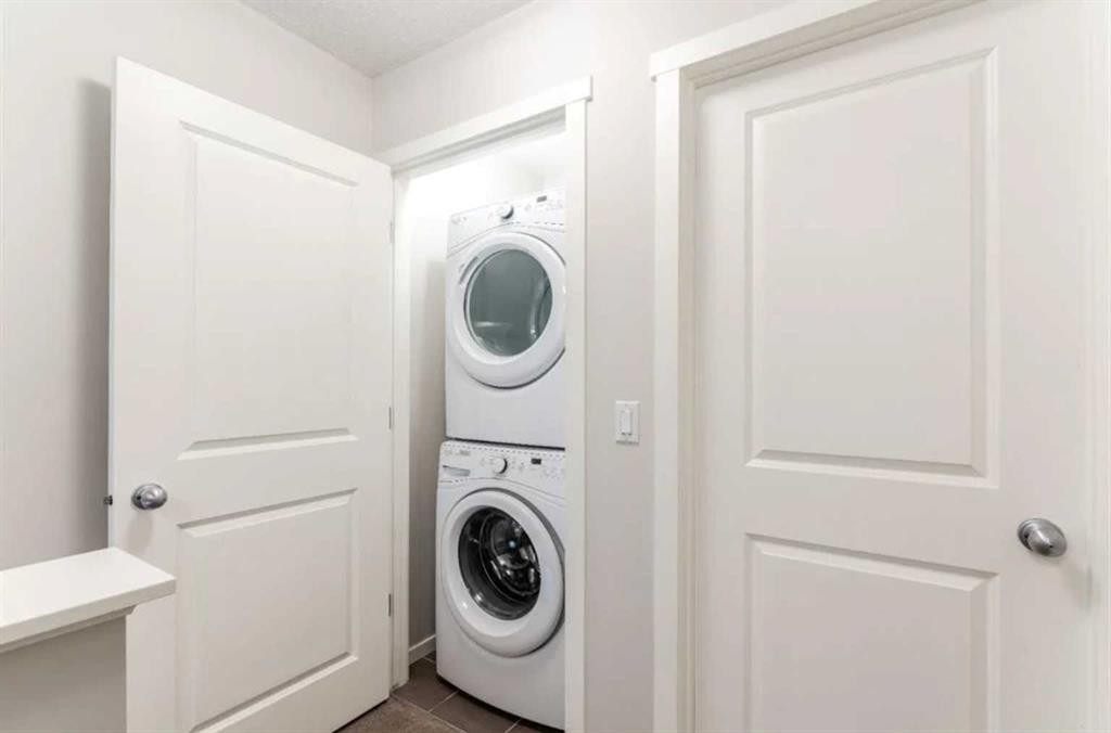 12 Legacy Main Street Se, Calgary, AB - Indoor Photo Showing Laundry Room