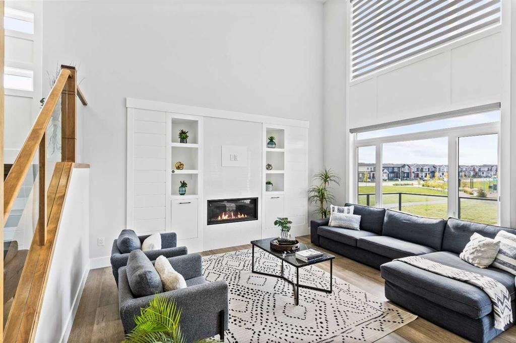 61 Sunvalley View, Cochrane, AB - Indoor Photo Showing Living Room With Fireplace