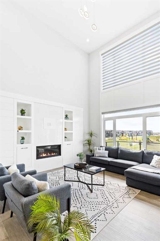 61 Sunvalley View, Cochrane, AB - Indoor Photo Showing Living Room With Fireplace