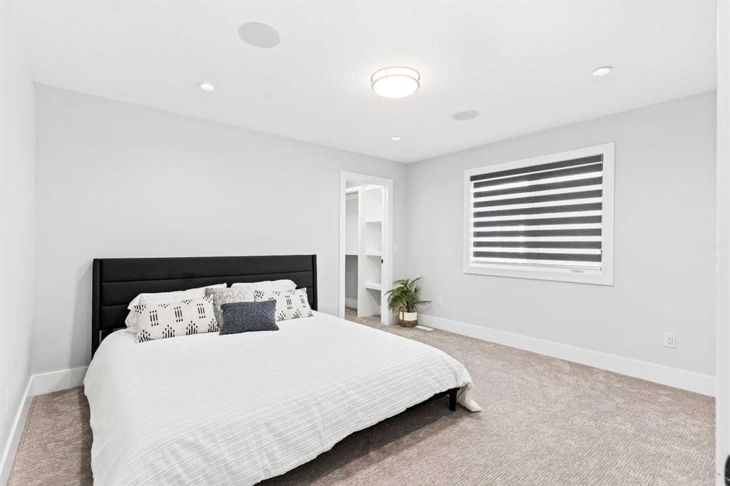 61 Sunvalley View, Cochrane, AB - Indoor Photo Showing Bedroom