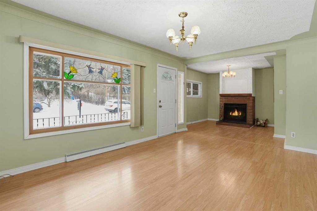 8624 33 Avenue Nw, Calgary, AB - Indoor Photo Showing Other Room With Fireplace