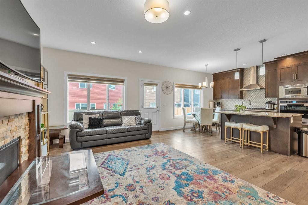 7672 80 Avenue Ne, Calgary, AB - Indoor Photo Showing Living Room With Fireplace