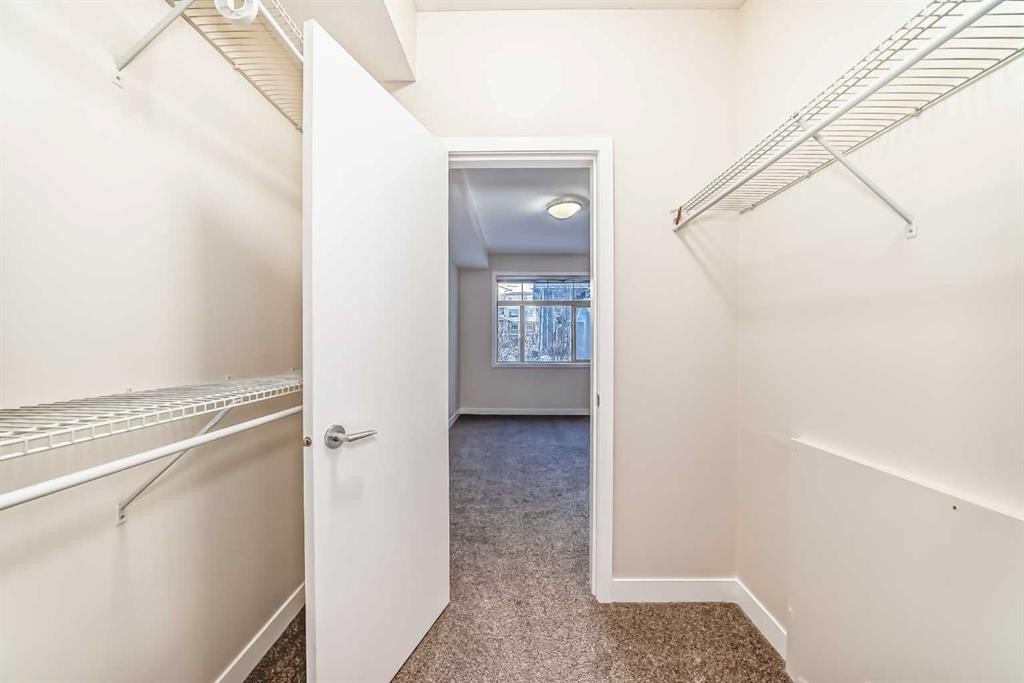 103-10 Auburn Bay Link Se, Calgary, AB - Indoor With Storage