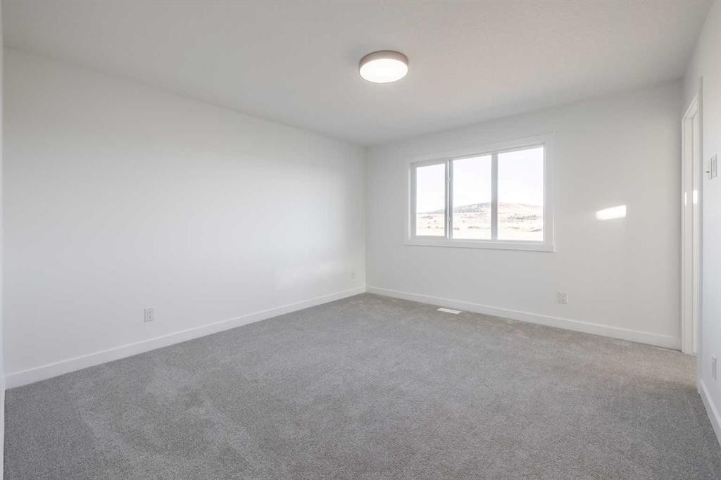 19 Appaloosa Way, Cochrane, AB - Indoor Photo Showing Other Room
