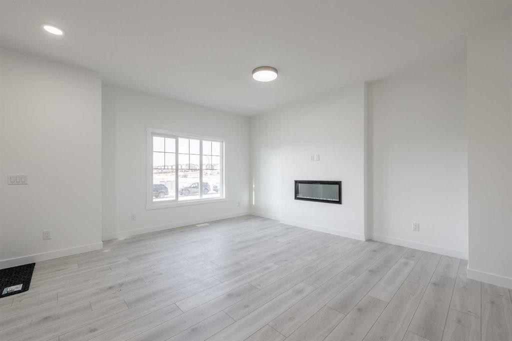 19 Appaloosa Way, Cochrane, AB - Indoor With Fireplace