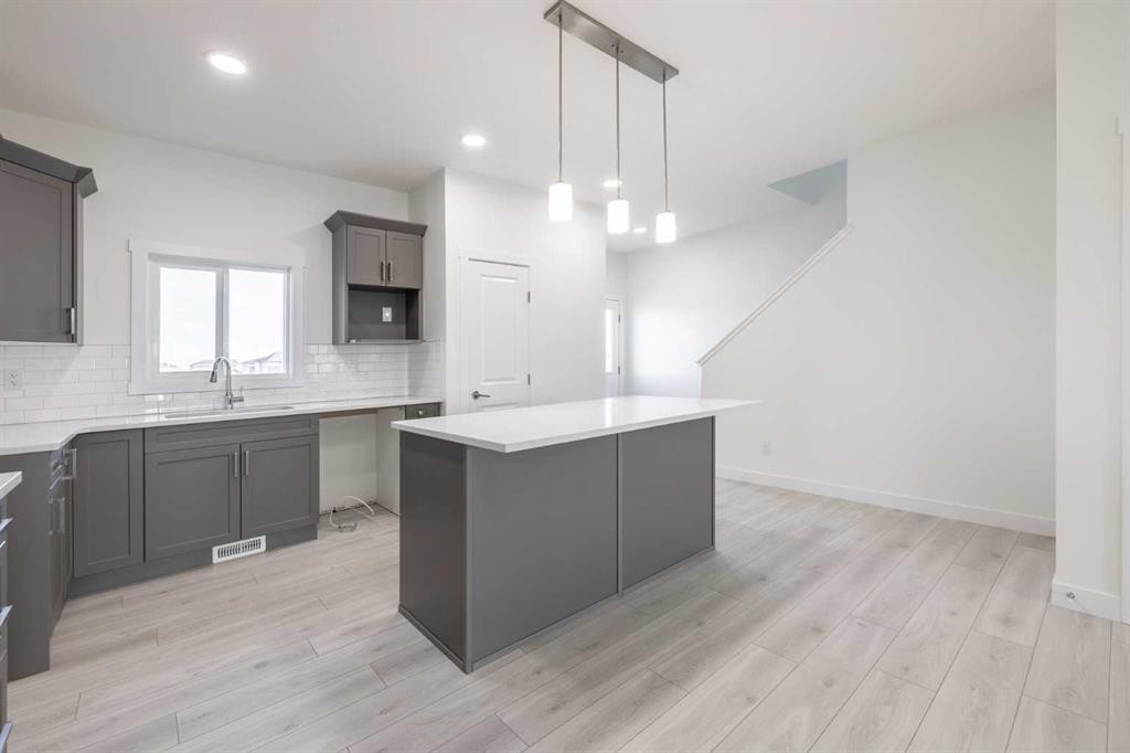 19 Appaloosa Way, Cochrane, AB - Indoor Photo Showing Kitchen With Upgraded Kitchen