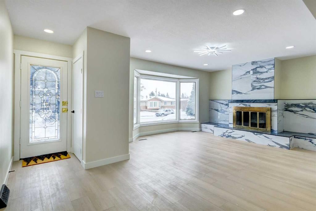 2443 42 Street Se, Calgary, AB - Indoor Photo Showing Living Room With Fireplace