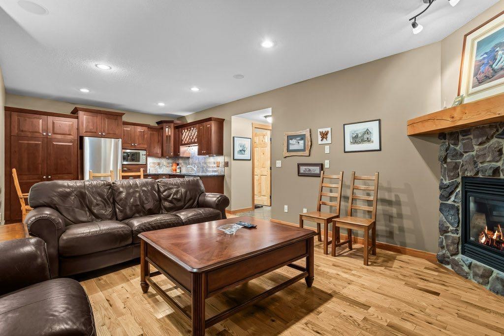 104 Stone Creek Place South, Canmore, AB - Indoor Photo Showing Living Room With Fireplace