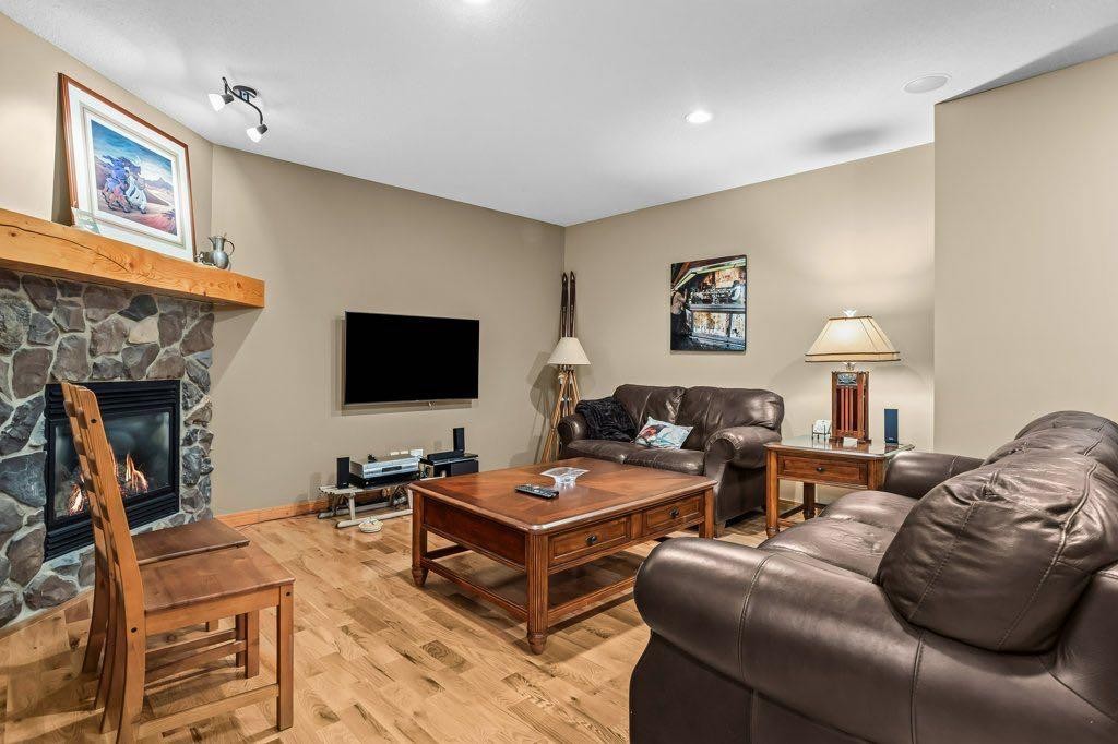 104 Stone Creek Place South, Canmore, AB - Indoor Photo Showing Living Room With Fireplace