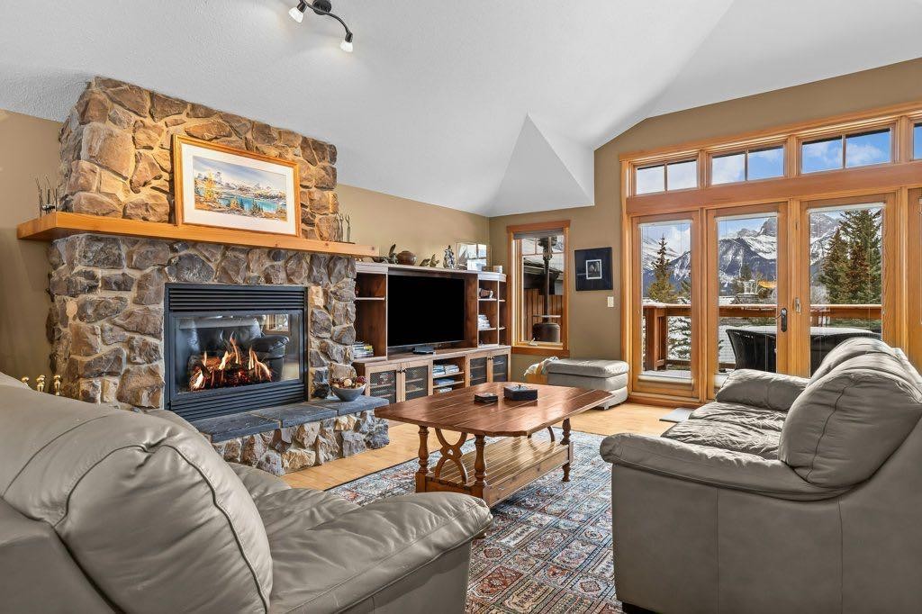 104 Stone Creek Place South, Canmore, AB - Indoor Photo Showing Living Room With Fireplace