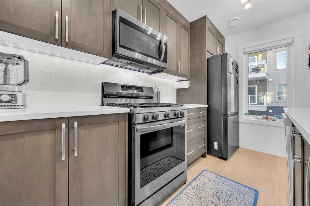 304-474 Seton Circle Se, Calgary, AB - Indoor Photo Showing Kitchen With Upgraded Kitchen