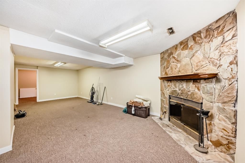 247 Bracewood Road Sw, Calgary, AB - Indoor With Fireplace