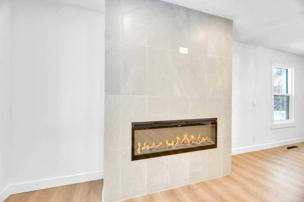 32 Allandale Close Se, Calgary, AB - Indoor With Fireplace