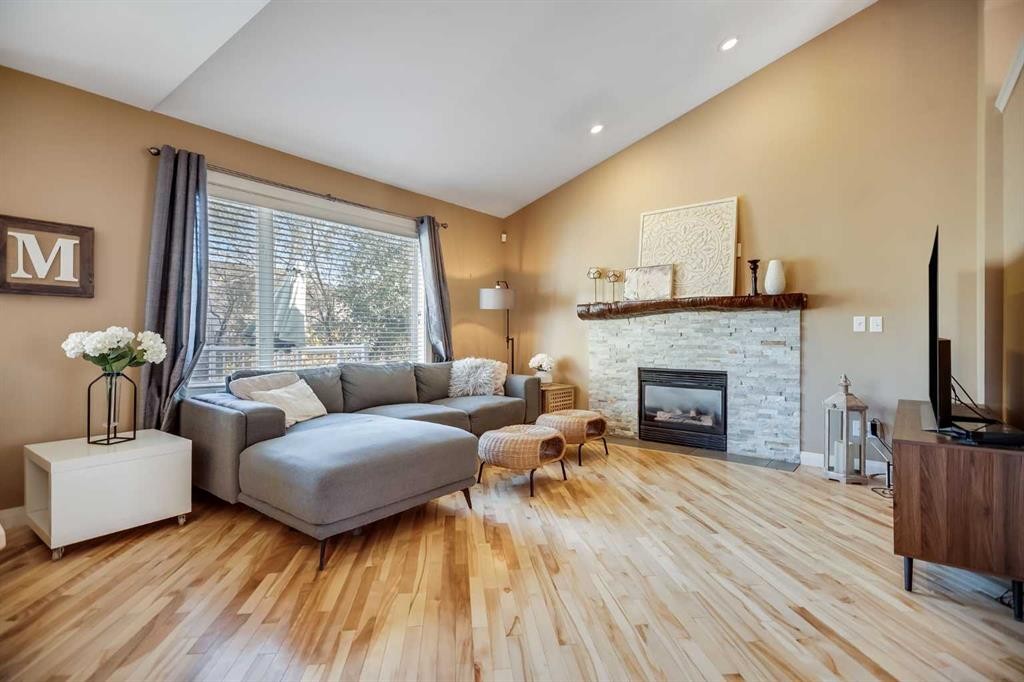 113 Somerside Green Sw, Calgary, AB - Indoor Photo Showing Living Room With Fireplace