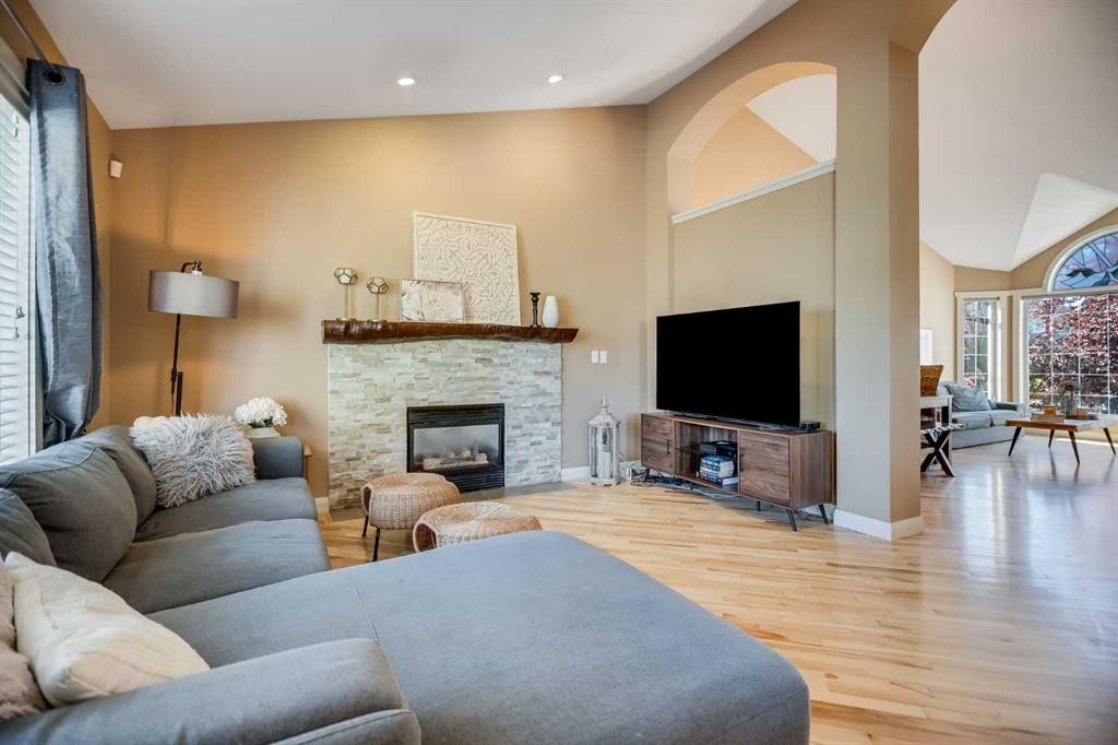 113 Somerside Green Sw, Calgary, AB - Indoor Photo Showing Living Room With Fireplace