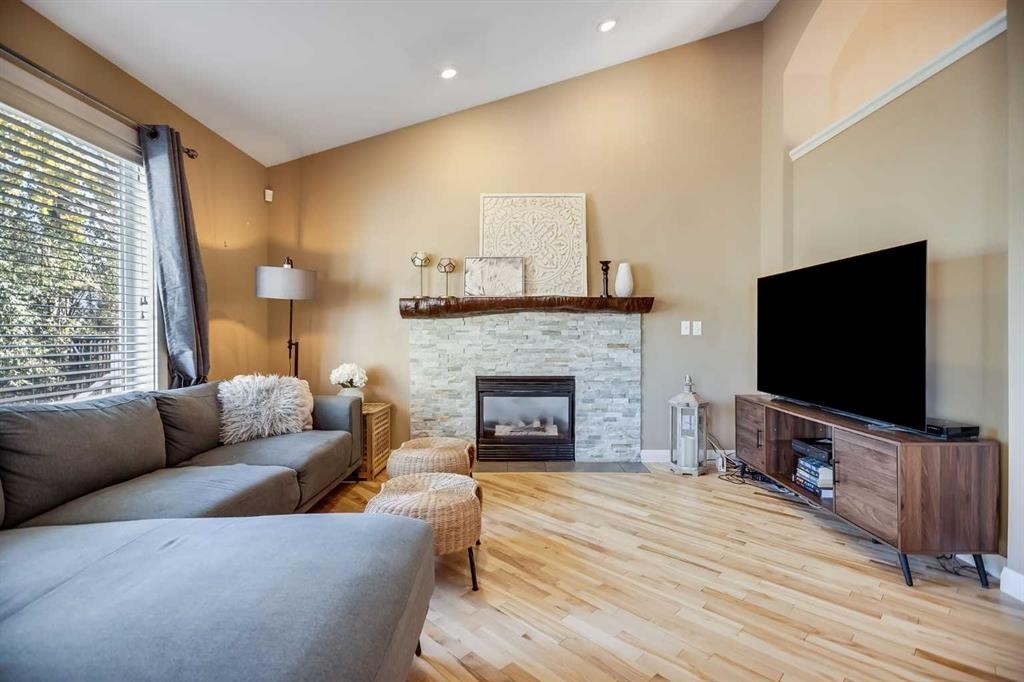 113 Somerside Green Sw, Calgary, AB - Indoor Photo Showing Living Room With Fireplace