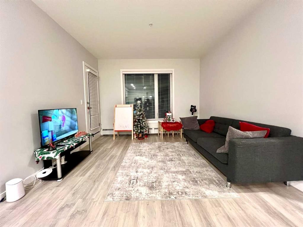 301-150 Shawnee Square Sw, Calgary, AB - Indoor Photo Showing Living Room