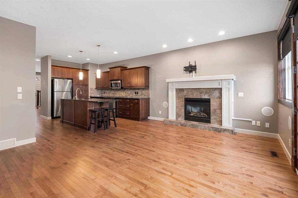 5628 Henwood Street Sw, Calgary, AB - Indoor Photo Showing Living Room With Fireplace