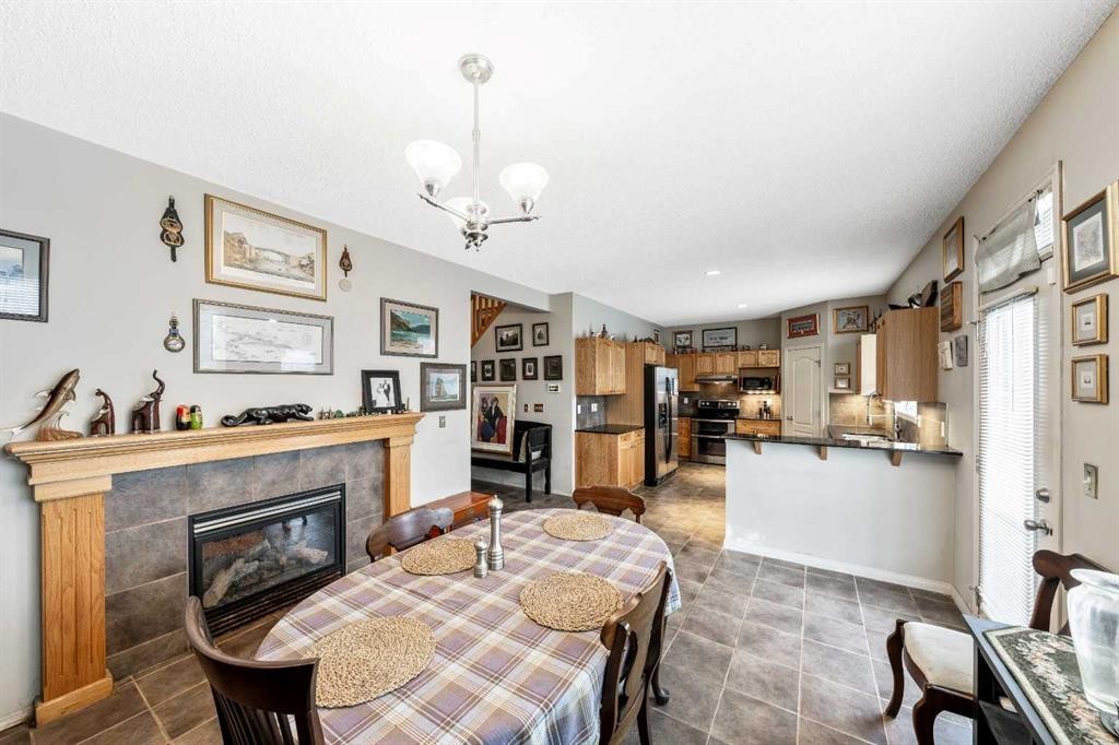 40 Mckinnon Street Nw, Langdon, AB - Indoor With Fireplace