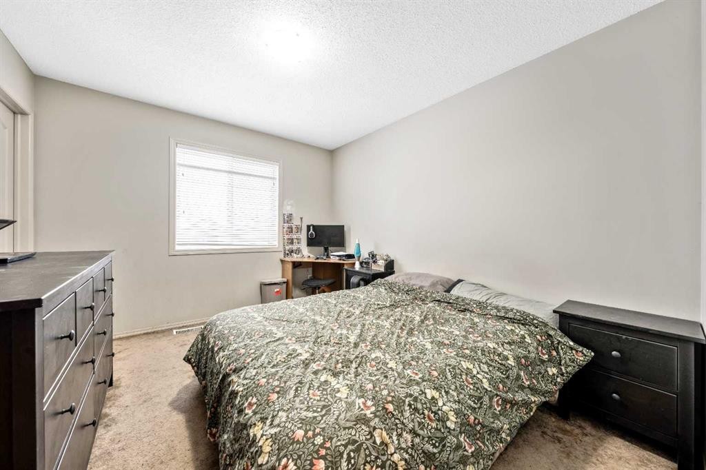 40 Mckinnon Street Nw, Langdon, AB - Indoor Photo Showing Bedroom