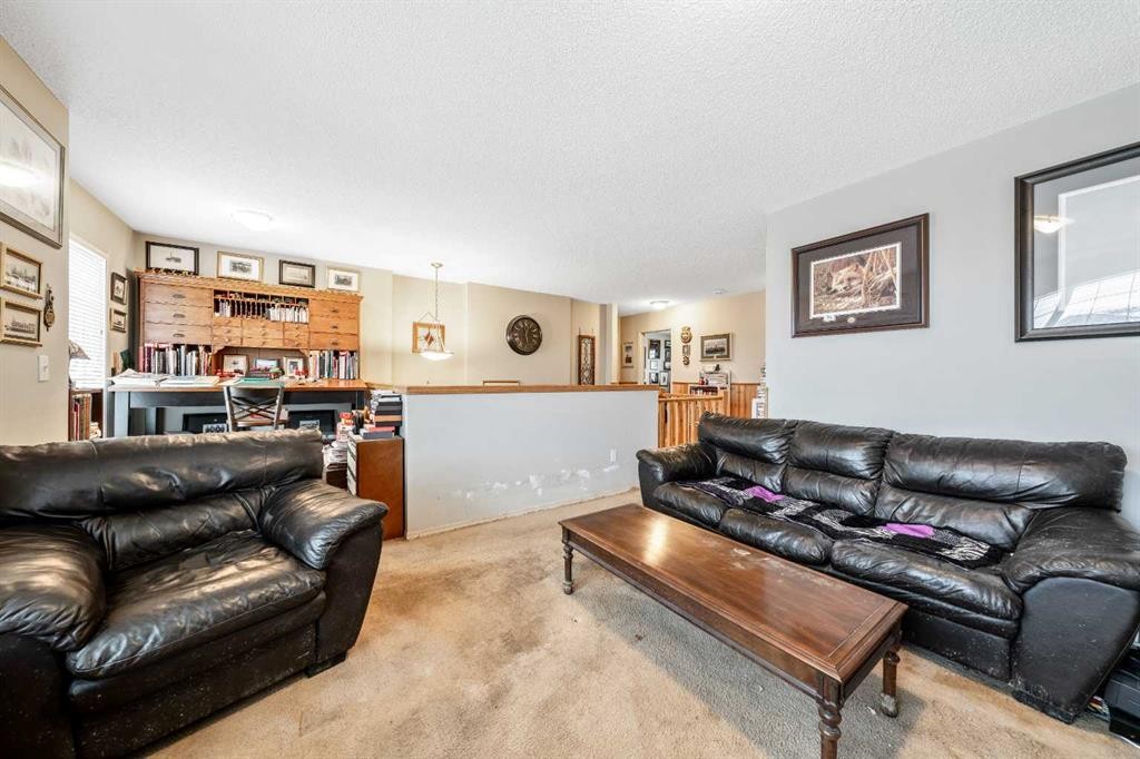 40 Mckinnon Street Nw, Langdon, AB - Indoor Photo Showing Living Room